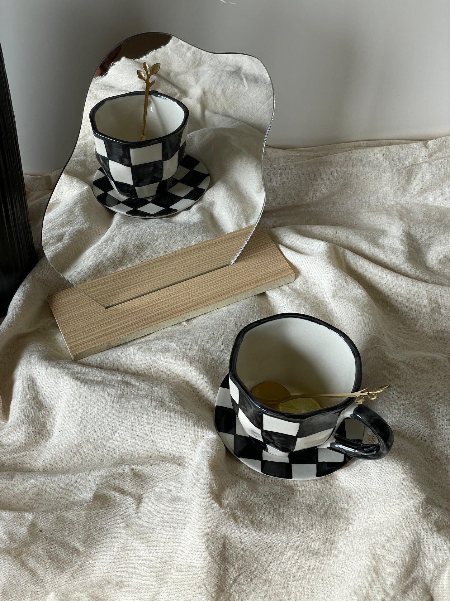 The Black Checkered Cup & Saucer