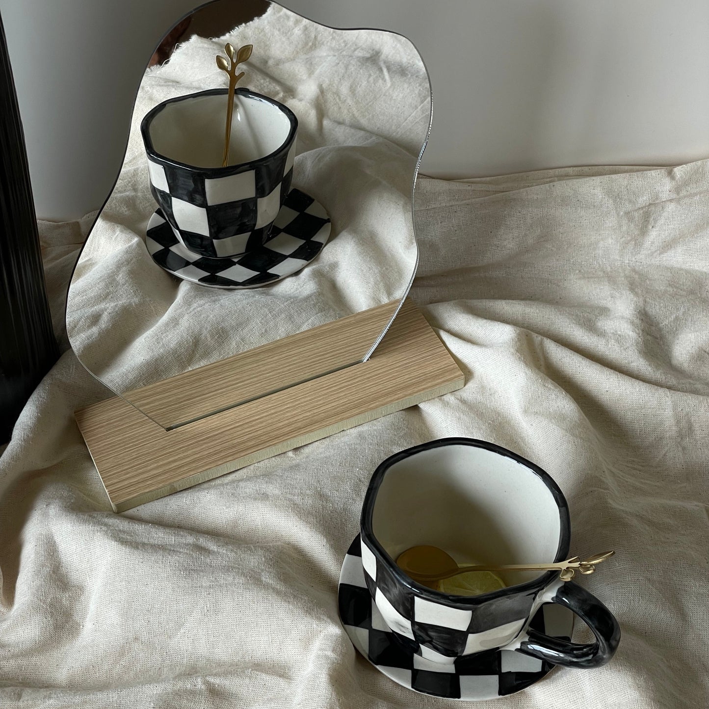 The Black Checkered Cup & Saucer